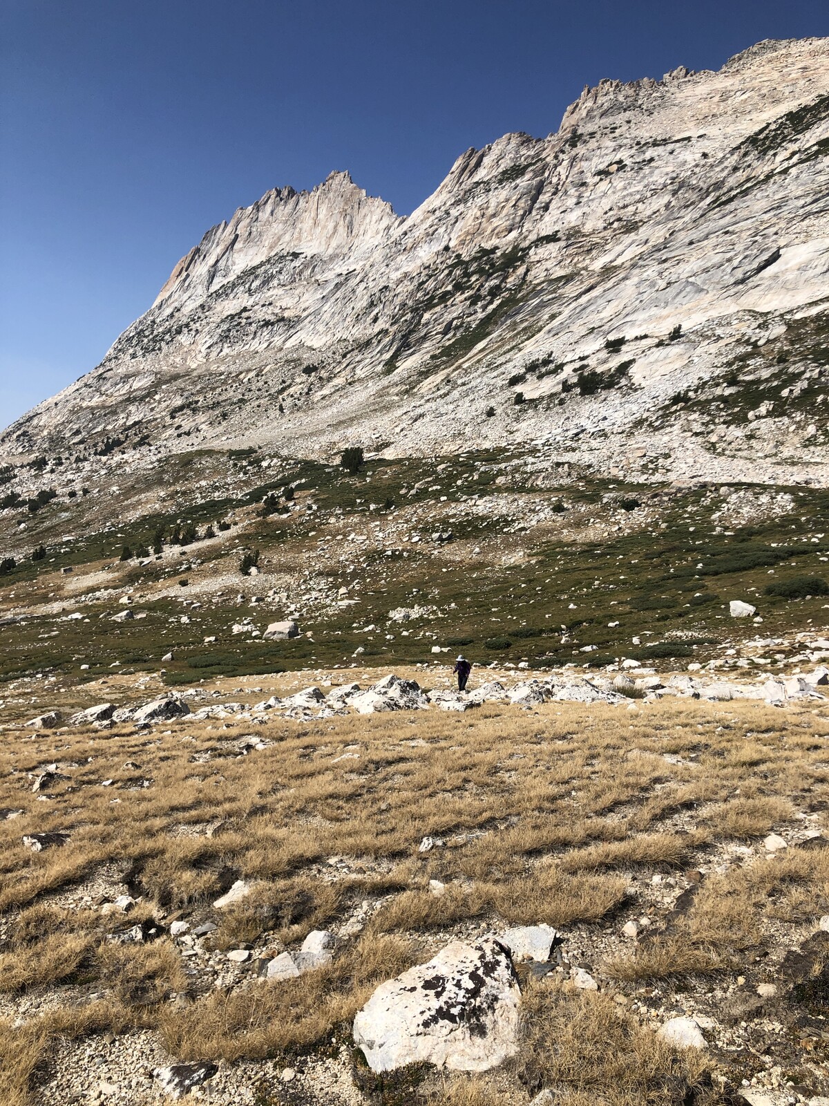 Mountain face with rocky scree slope in alpine basin