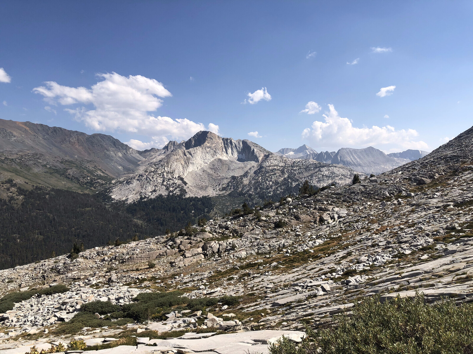 Deep blue alpine lake in exposed high elevation basin