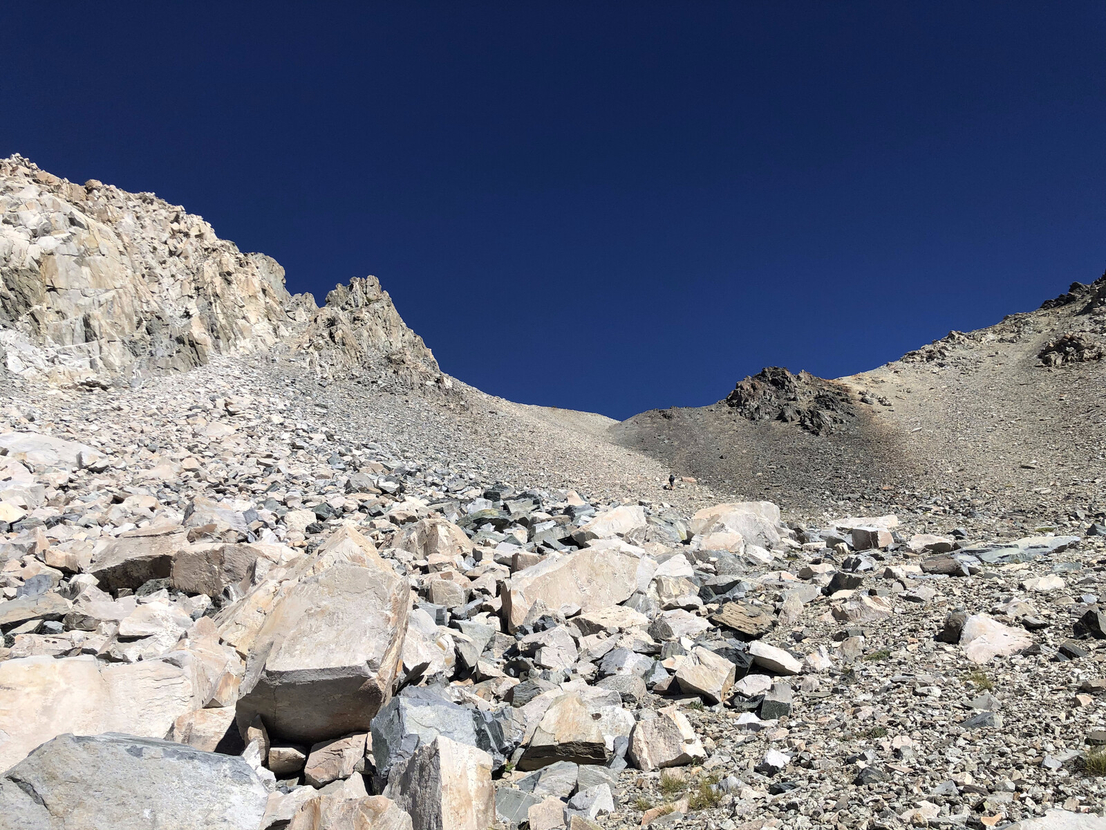 Turquoise alpine lake reflecting rocky peak formations